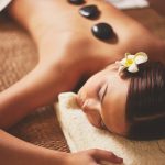 Portrait of young female lying in spa salon during beauty procedure