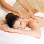 Woman having massage of body in the spa salon. Beauty treatment concept.